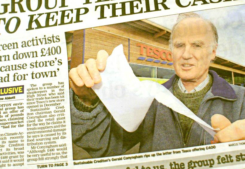 Newspaper cutting with photograph of Gerald Conyngham tearing up a letter from Tesco