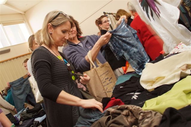Picture of a lady choosing something at the 2011 Clothes Swop