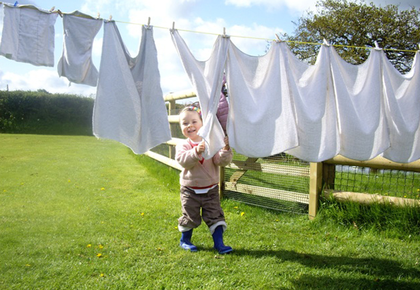 Picture of a child by a washing line