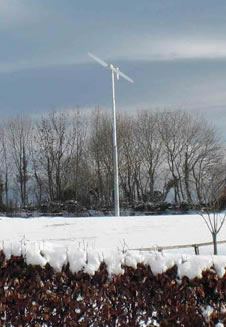 Photograph of a wind turbine in the snow taken at Higher Park Farm, Pennymoor