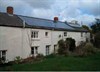 Photograph of photovoltaic panels on a cottage roof