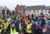 Photograph of cyclists in Crediton cheering at the end of their bike ride