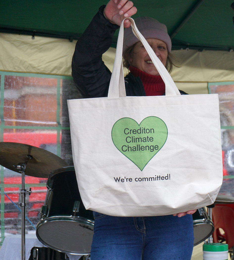 Photograph of a tote bag labelled: Crediton Climate Challenge - We're committed