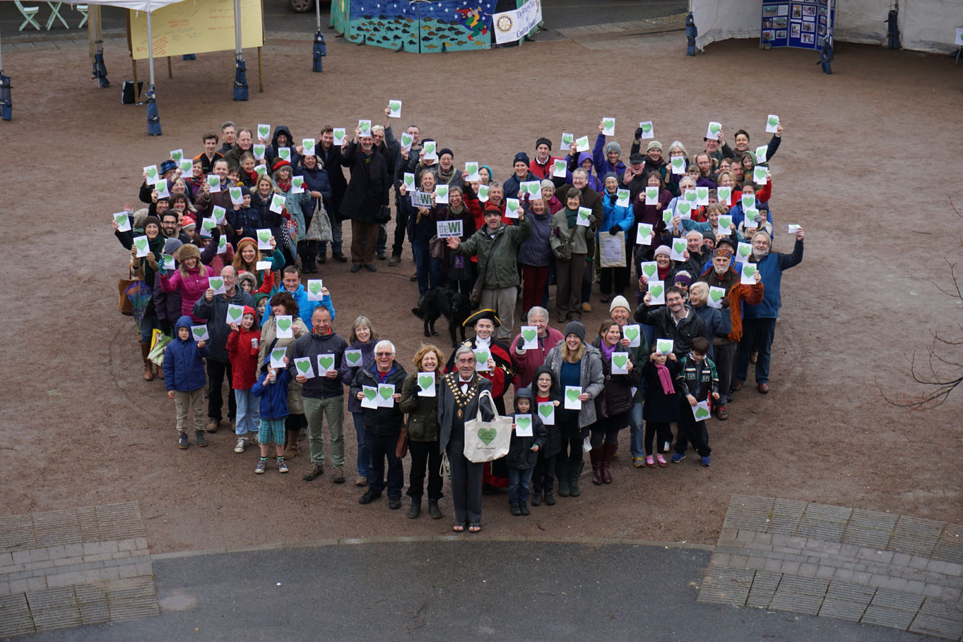 Photograph of a group of people in a heart shape