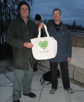 Photograph of Gerald Conyngham handing Crediton commitments to Mel Stride's assistant, Mike Knuckey at Lambeth Bridge